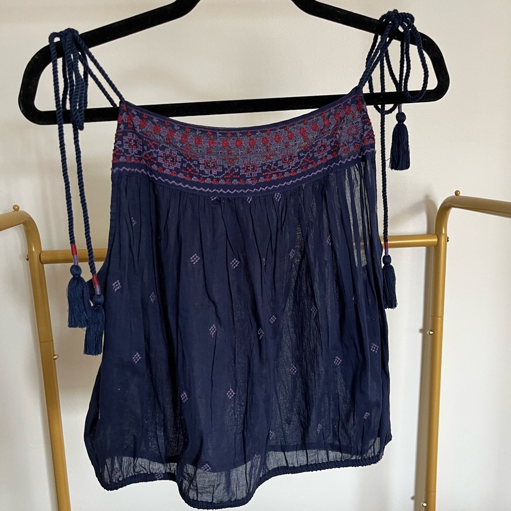 Like new- Free people tank top. Light weight. Rope tie straps